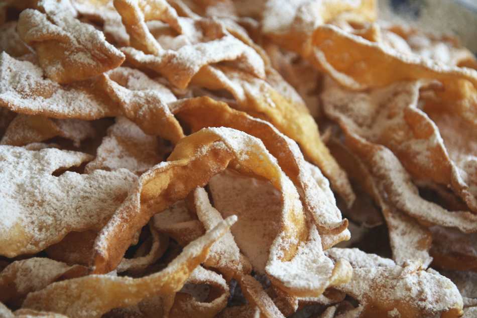 a close up of a pile of chiacchiere, an italian carnevale sweet